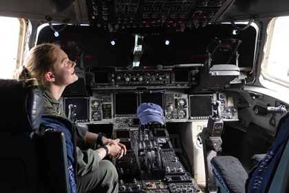 Madeline Welin sits at the flight deck of a Boeing C-17 Globemaster III. Photo by Rebecca Boone.